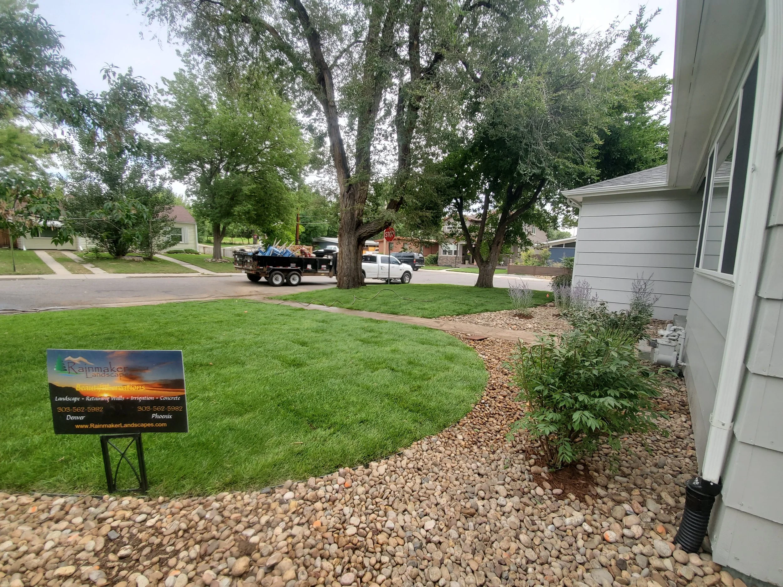 Denver front yard sod and shrubs river rock
