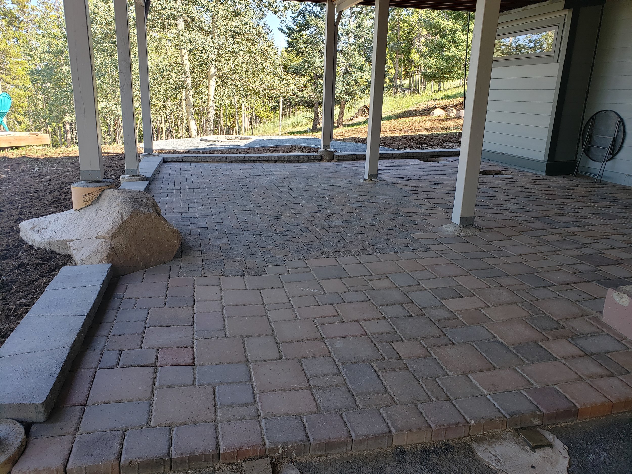 Removed a pond and matched years old pavers to finish off the paver patio space