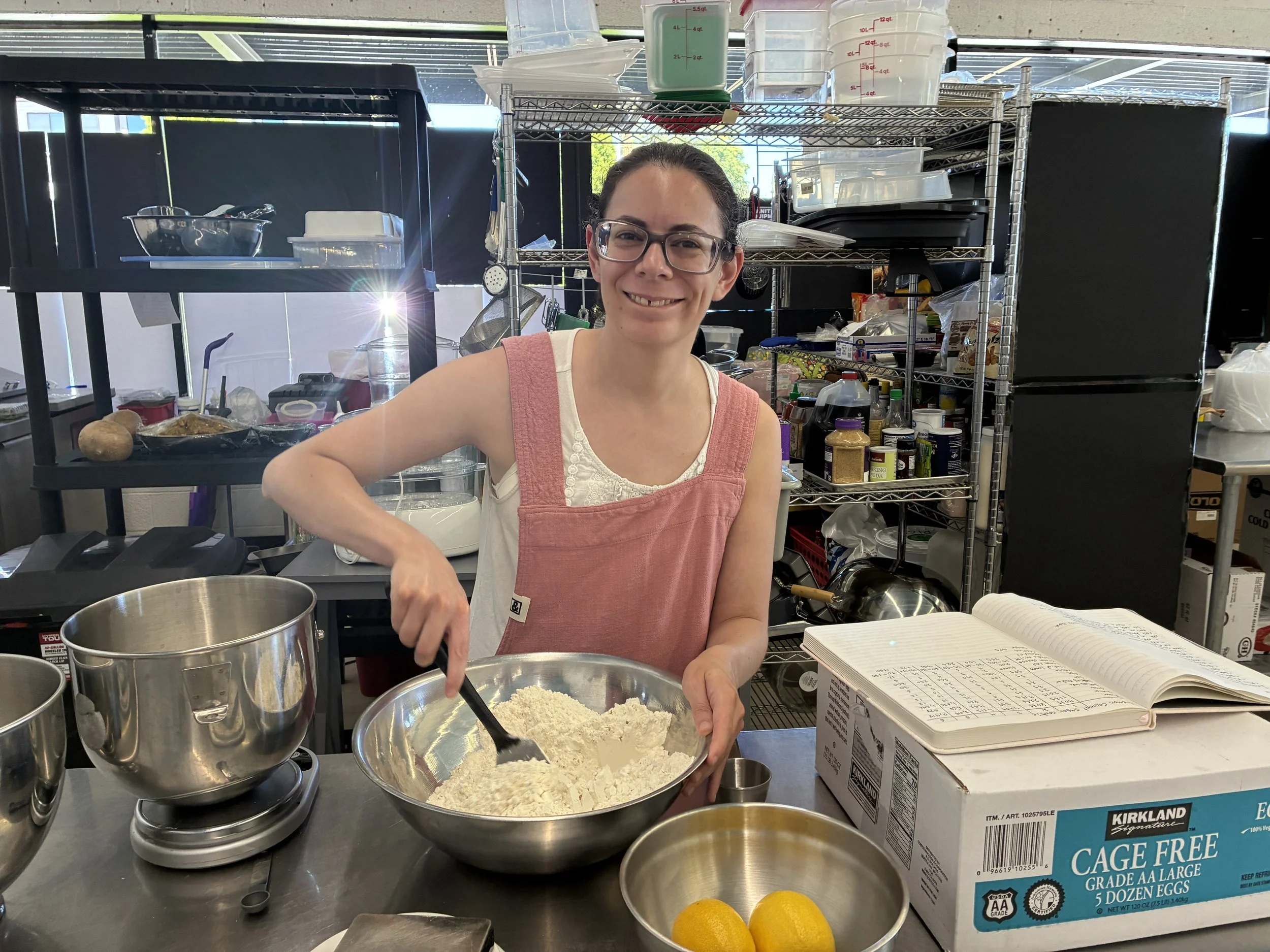 Mixing dry ingredients in the Rae’s Salted Sweets kitchen.
