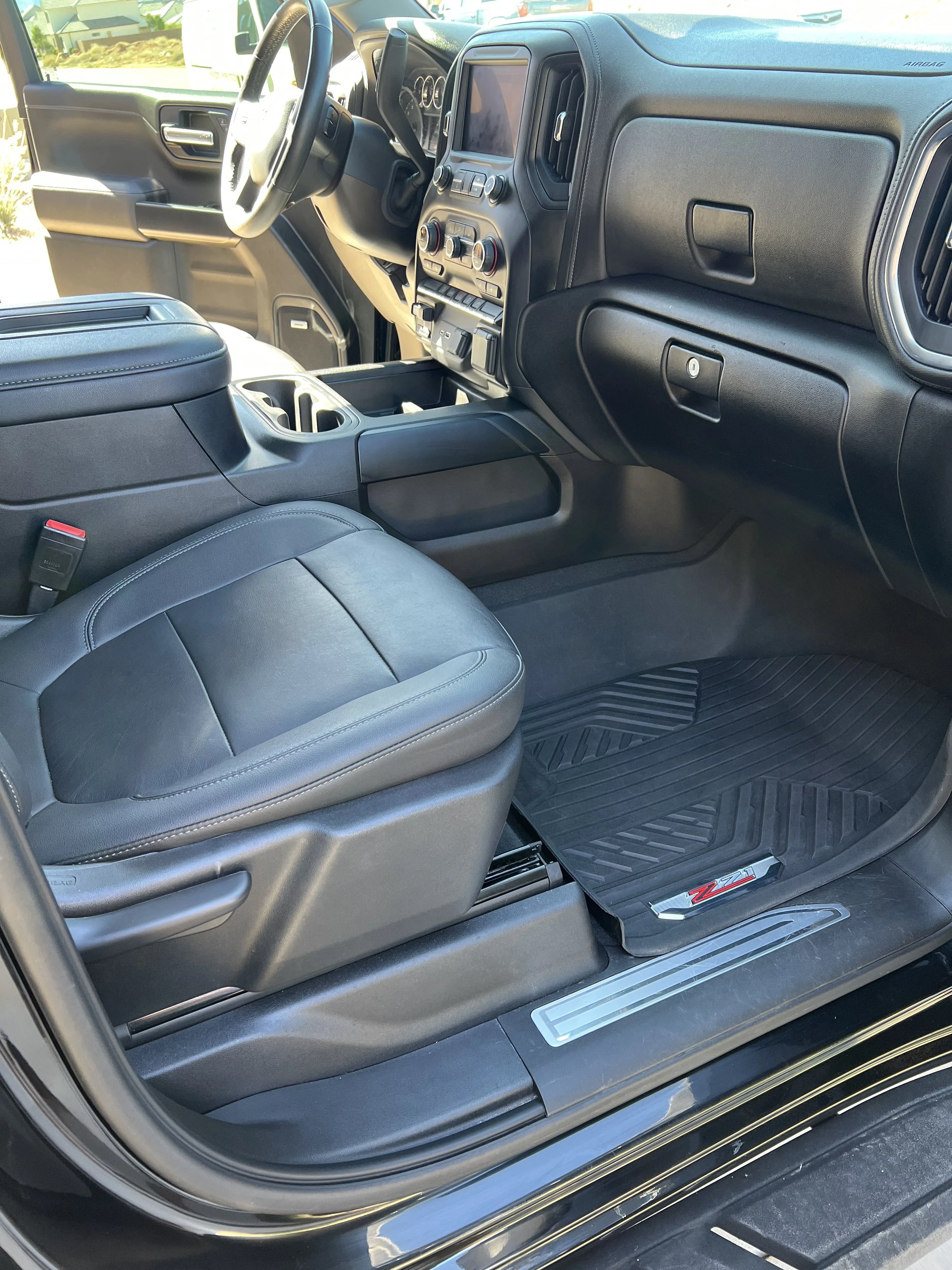 Passenger side front seat showing a deep interior cleaning done on a Chevrolet Silverado