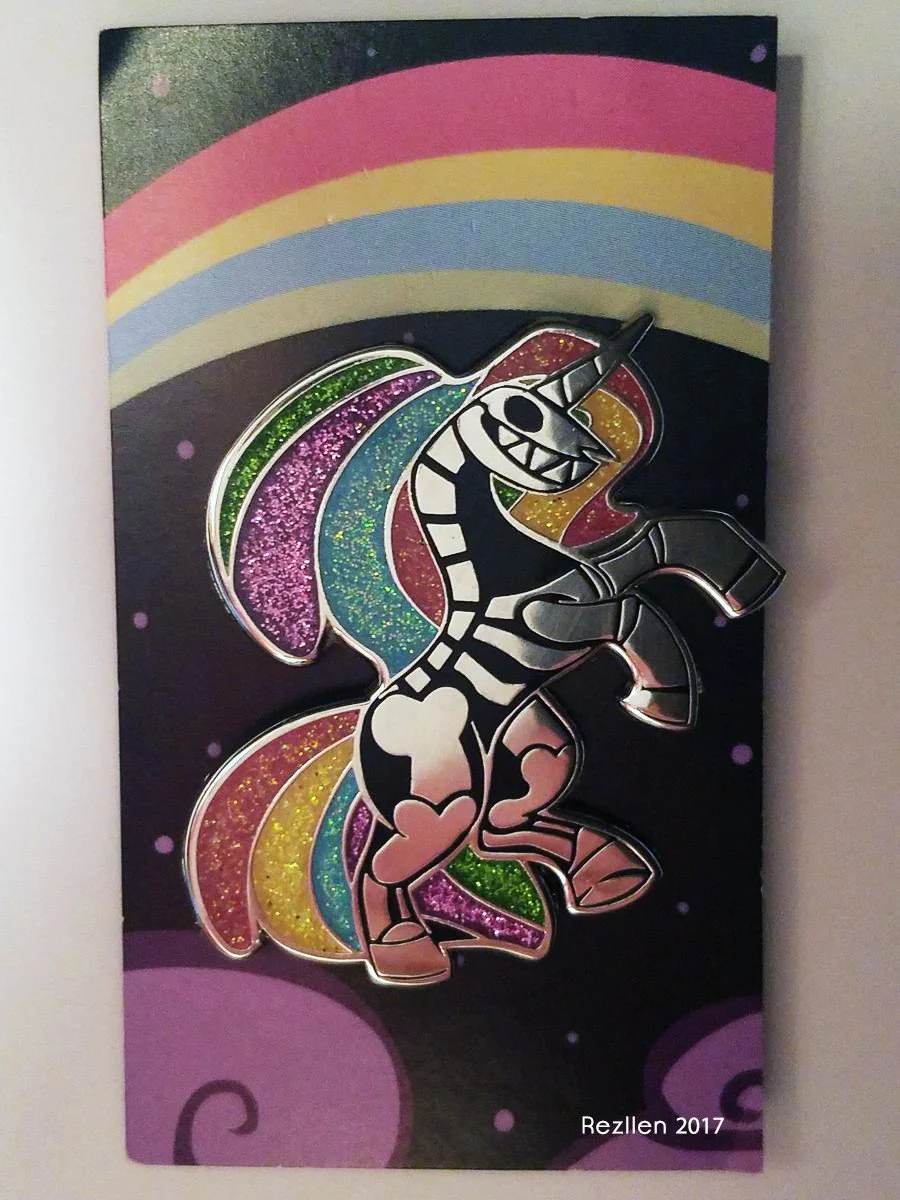 Colorful drawing of a cartoon unicorn with rainbow-colored mane and tail, set against a dark background with rainbow and cosmic accents. The unicorn has a striped body and a playful expression.