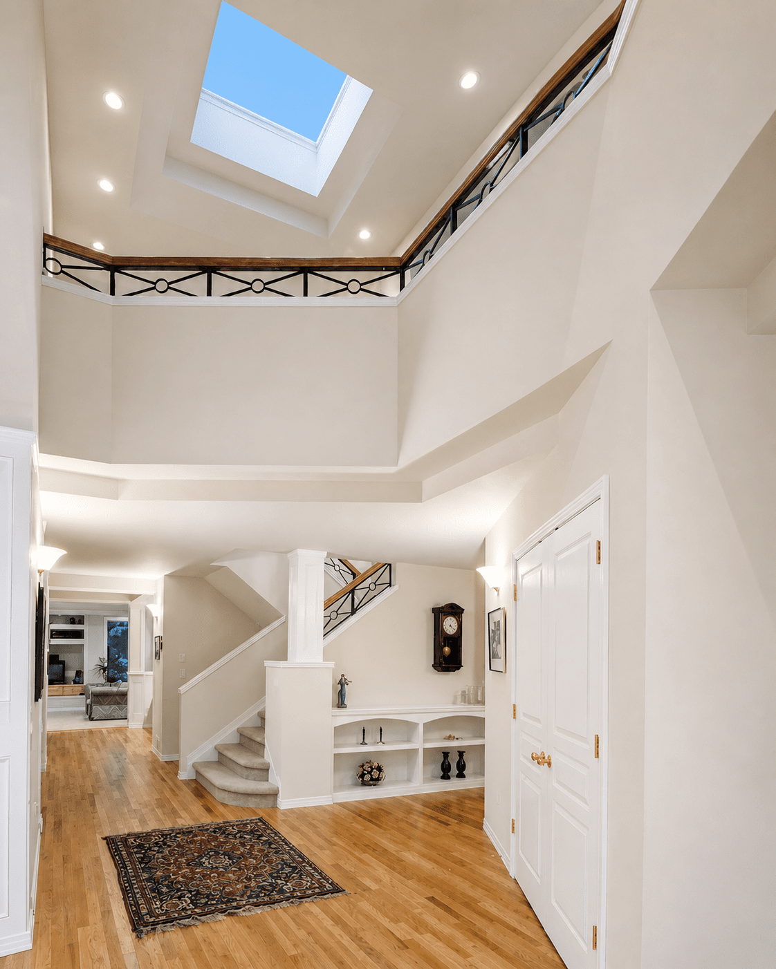 two-story-skylit-foyer-wrought-iron-railing-north-boulder-co.png