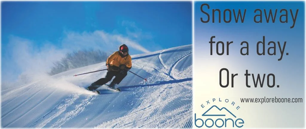 A skier in a yellow jacket wearing a helmet skiing down a snow-covered slope with a clear blue sky. Text on the right side reads: 'Snow away for a day. Or two.' with website exploreboone.com and explore boone logo.