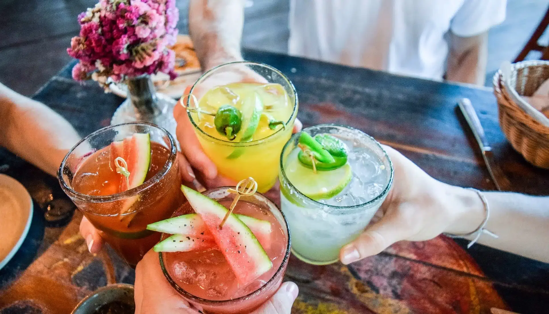 129-people-holding-cocktails.webp