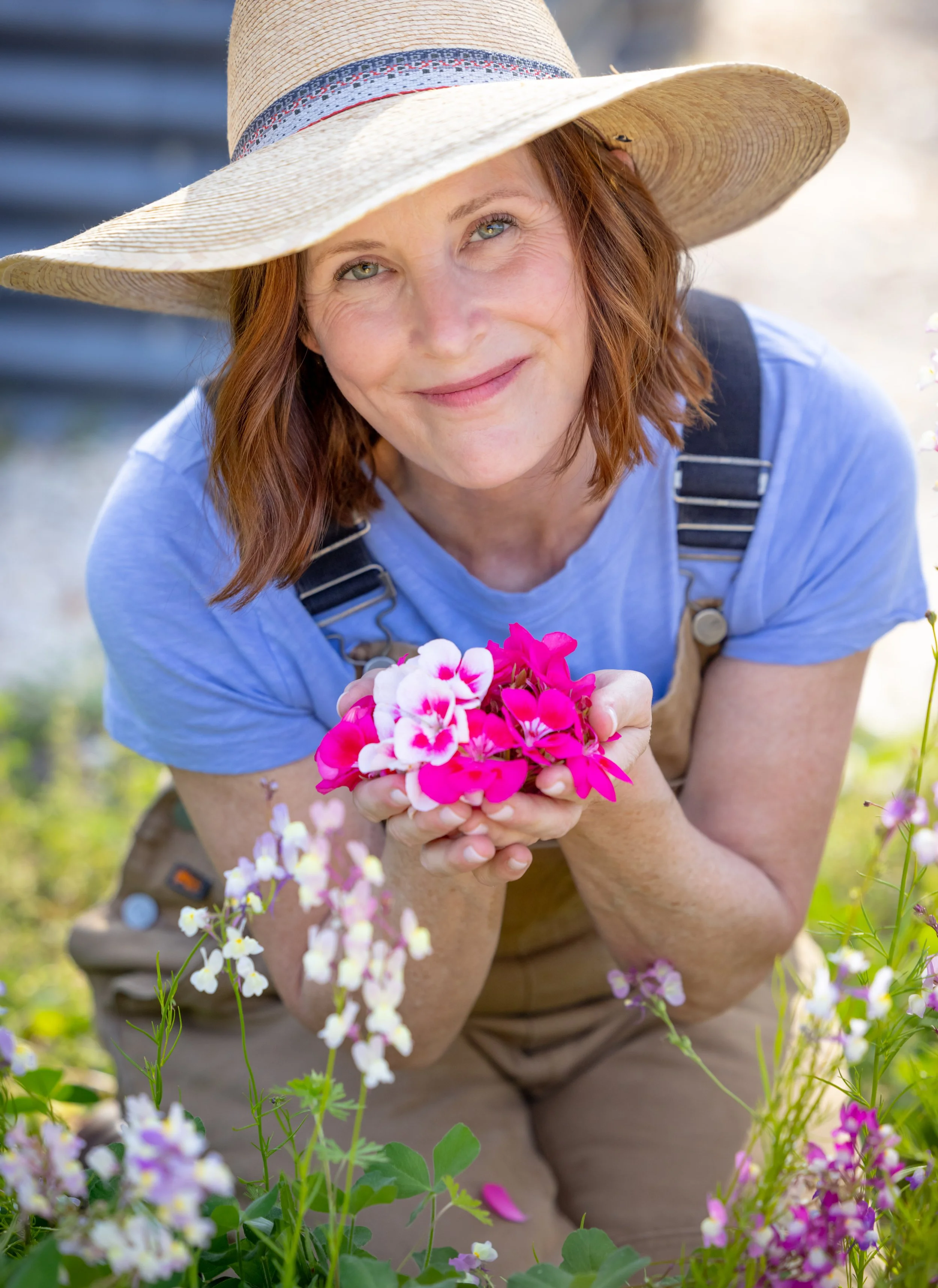 Ann Zalla, owner and artisan pastry chef, tending to edible flower and herb garden at Charleston pastry studio
