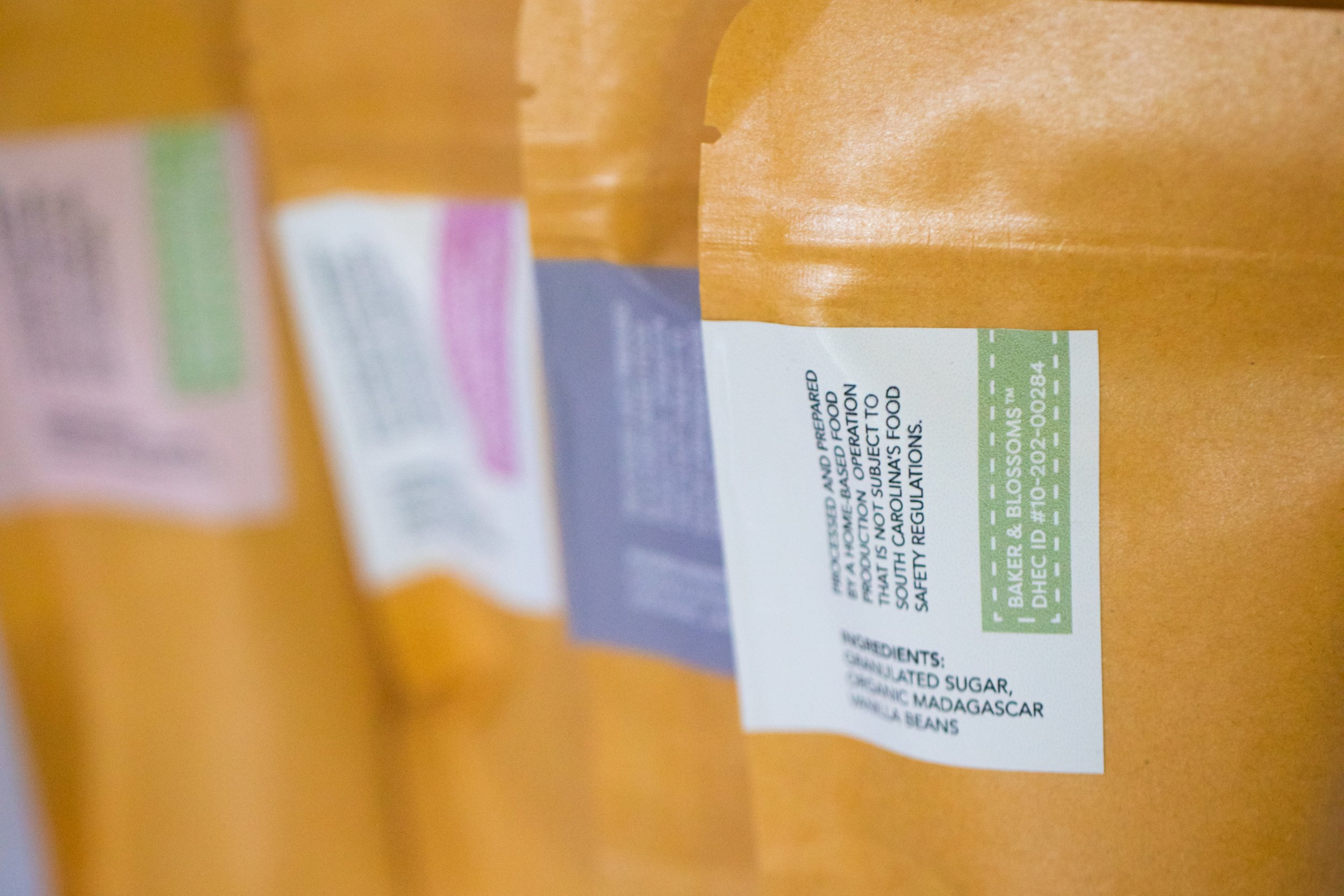 Botanical infused flavored sugars from Charleston pastry studio—mint, lavender, vanilla, rose, and strawberry flavors available for wholesale to local shops and gourmet retailers