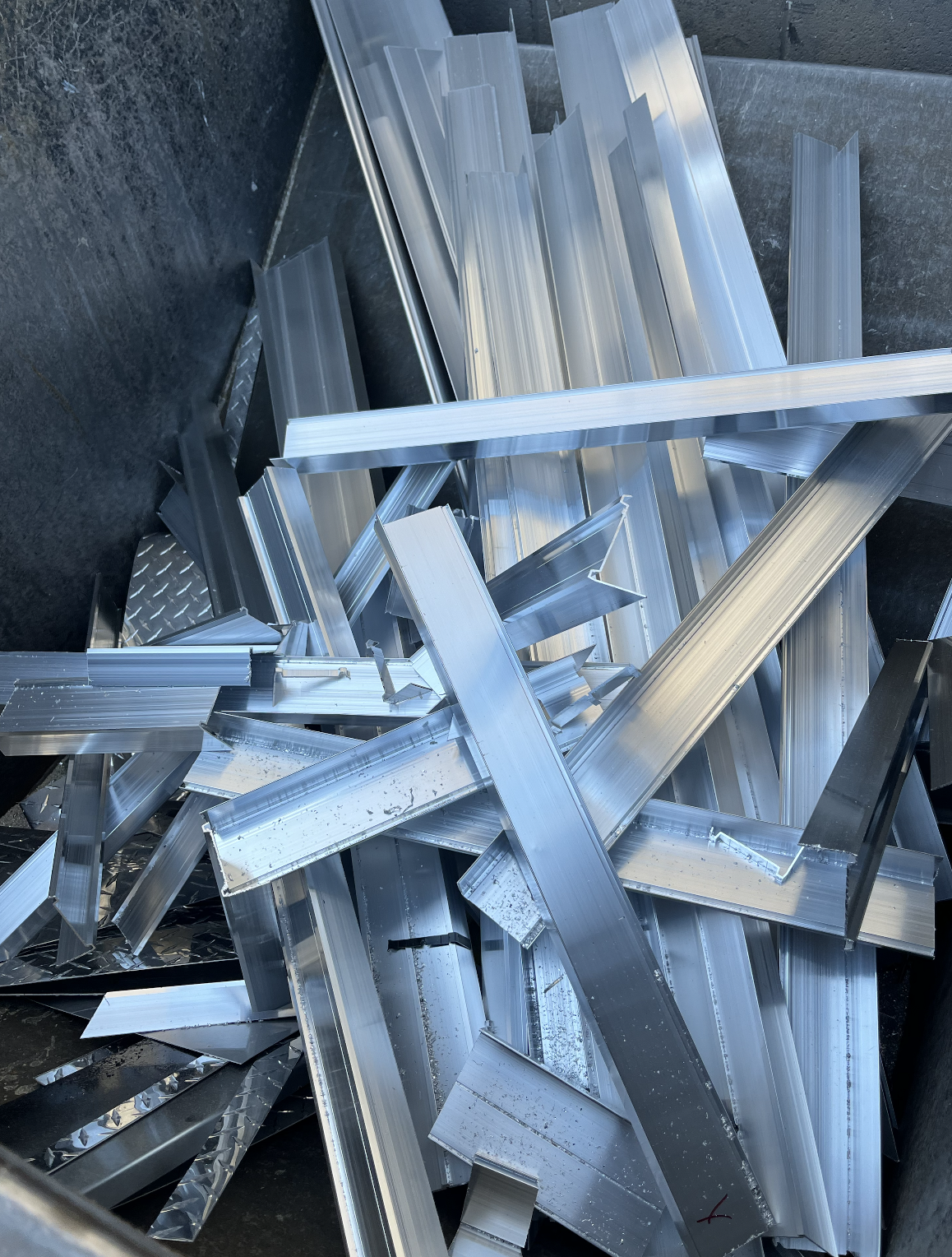 Aluminum extrusions and aluminum scrap ready for recycling