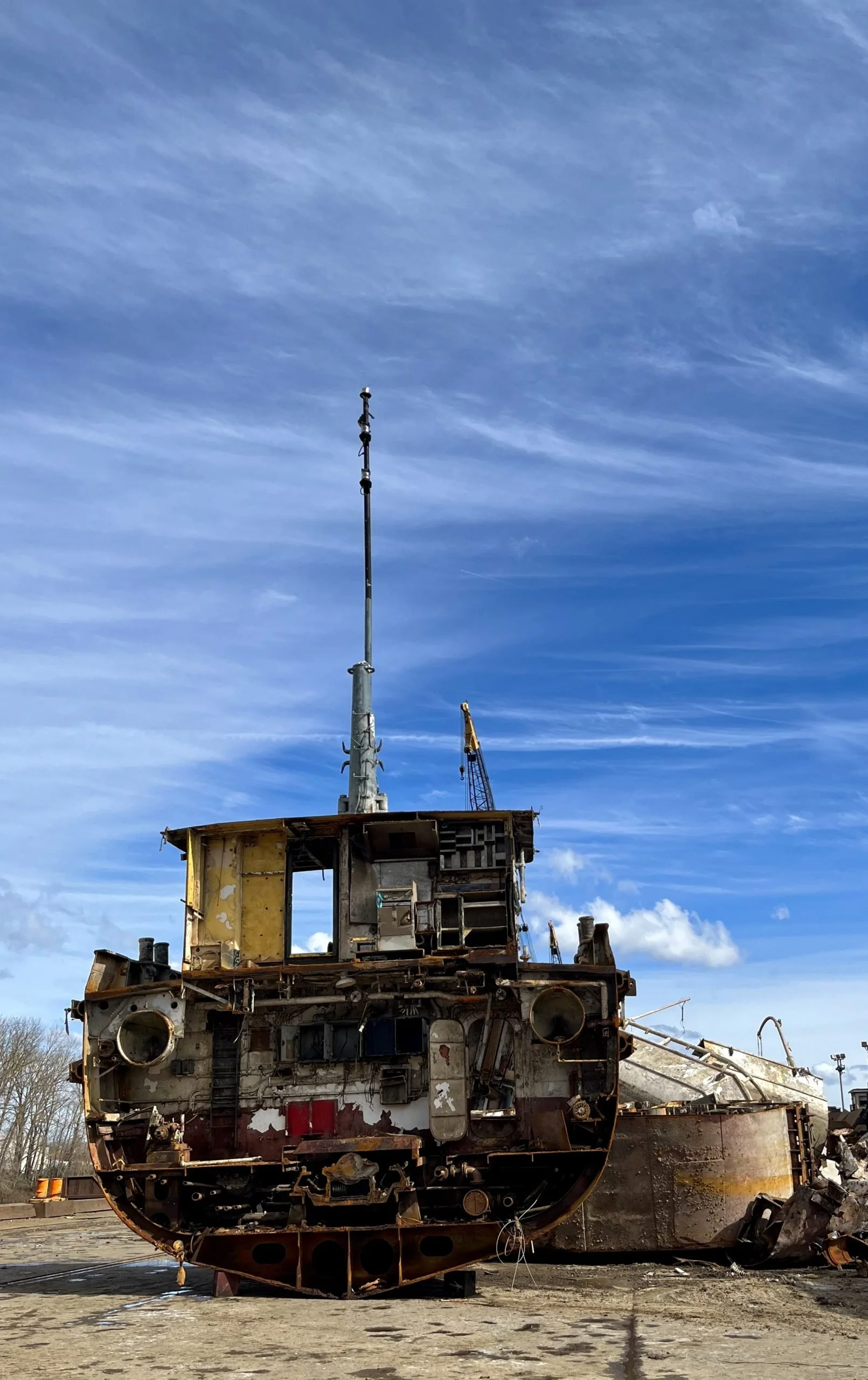 Steel ship being recycled at a scrap metal recycling facility
