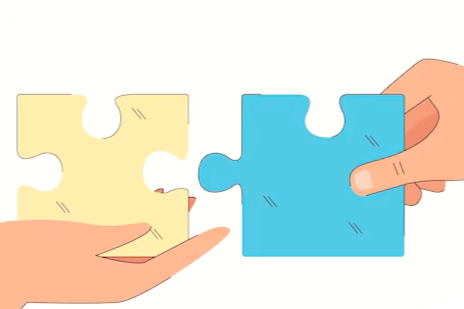 Two hands holding separate puzzle pieces, one yellow and one blue, about to connect.