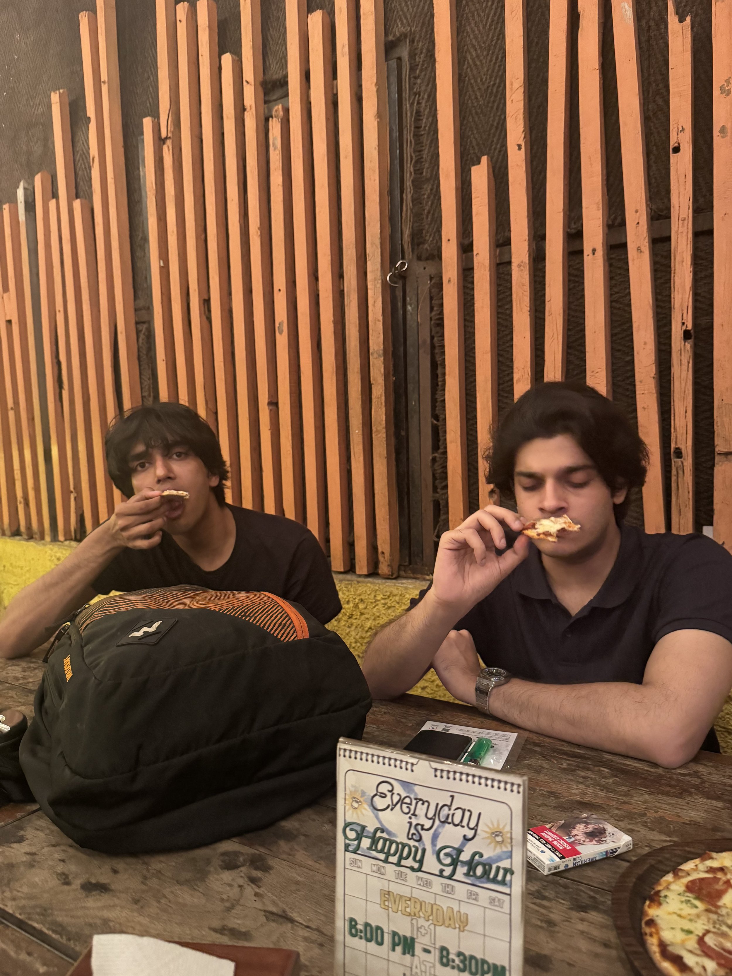 hulo and dipan enjoying pizza at bonobo