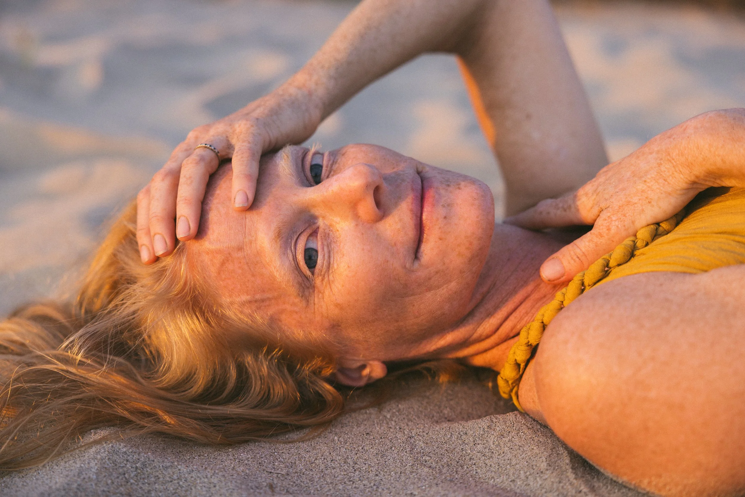 Portrait of Claire, founder and guide of Primal Devotion, whose work blends Earth Tantra, movement, dance, music, and emotional intelligence.