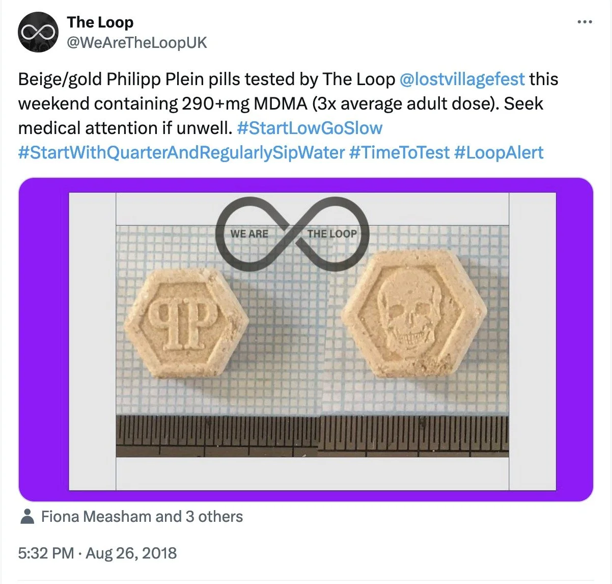 Two beige pills with hexagonal shape and embossed symbols: one with 'PP' and one with a skull, placed on a grid paper with a ruler below.