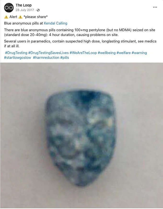 Blue anonymous pill with a face design, used for drug testing.