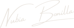 Signature-style text reading 'Nadia Borilla' in white on a transparent background.