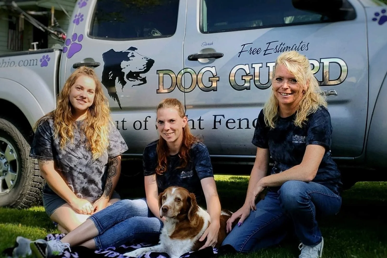 Dog Guard of Ohio owner and team members standing together with dog representing local out of sight fencing installation and service