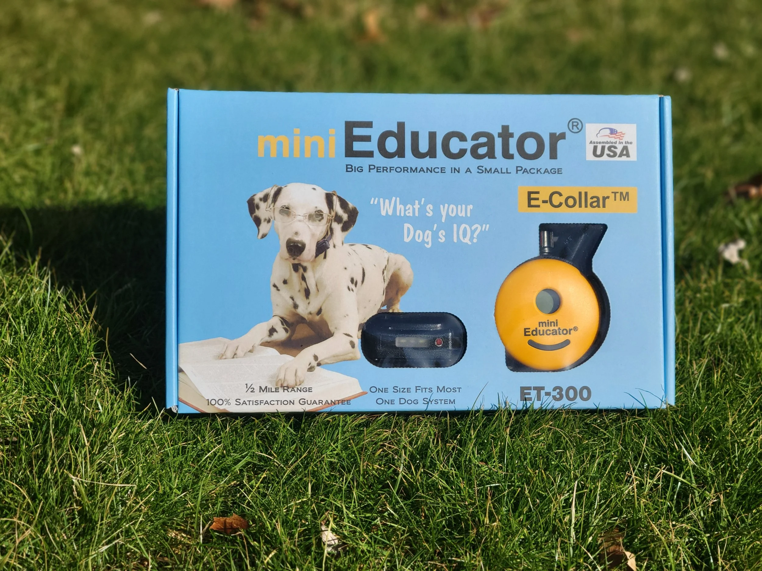 Mini Educator 300TS remote dog training collar system with transmitter and receiver displayed on packaging
