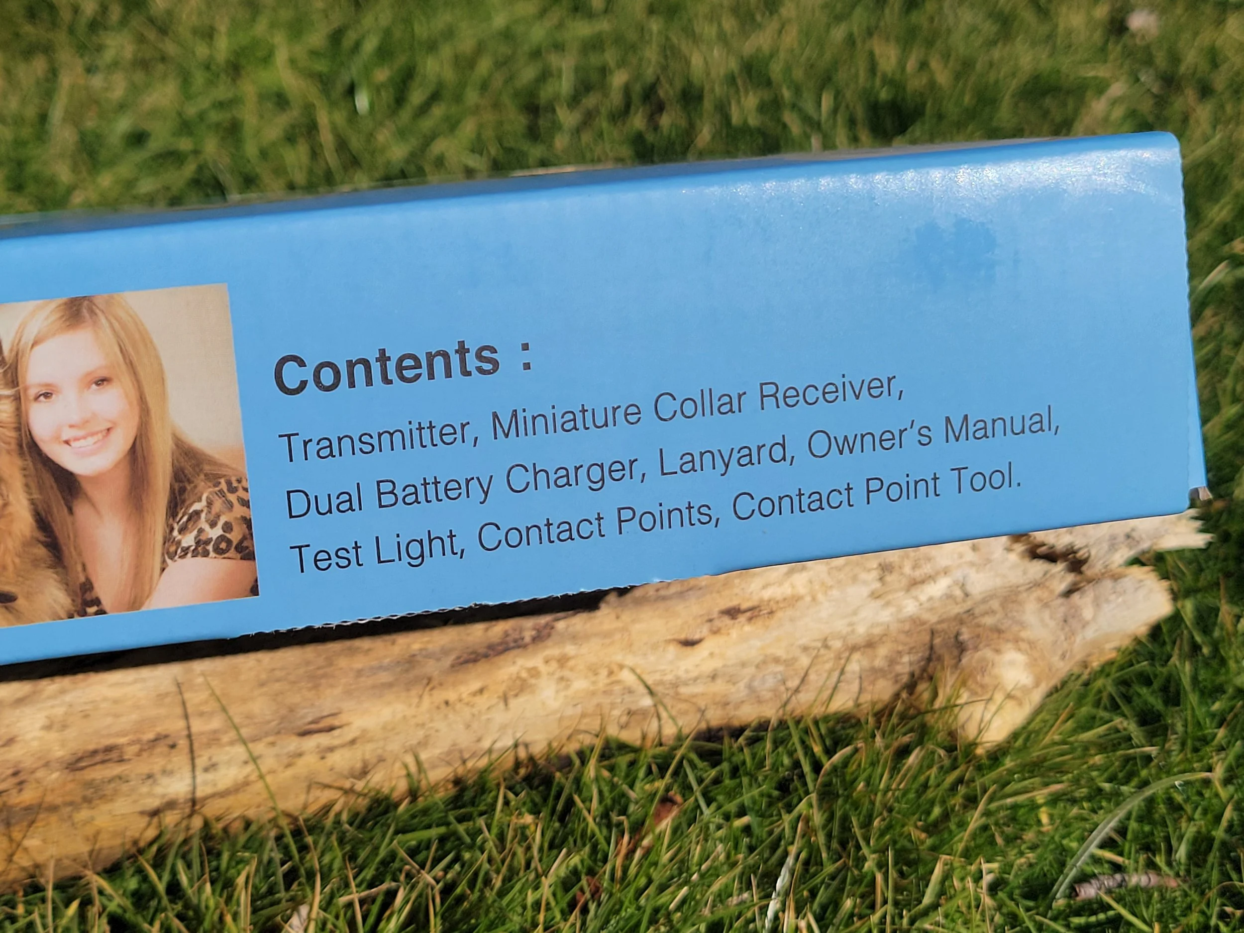 Close-up of Mini Educator training collar packaging showing included components and system details