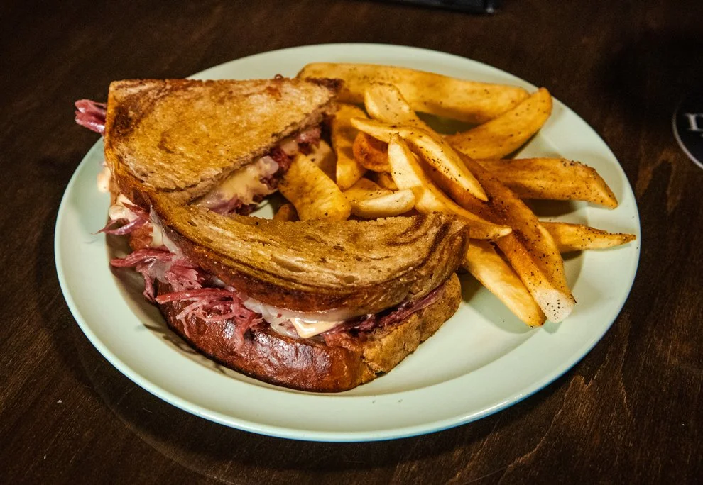 House-made Reuben sandwich with corned beef, sauerkraut, Swiss cheese, and fries at Donovan's Irish Pub & Restaurant.