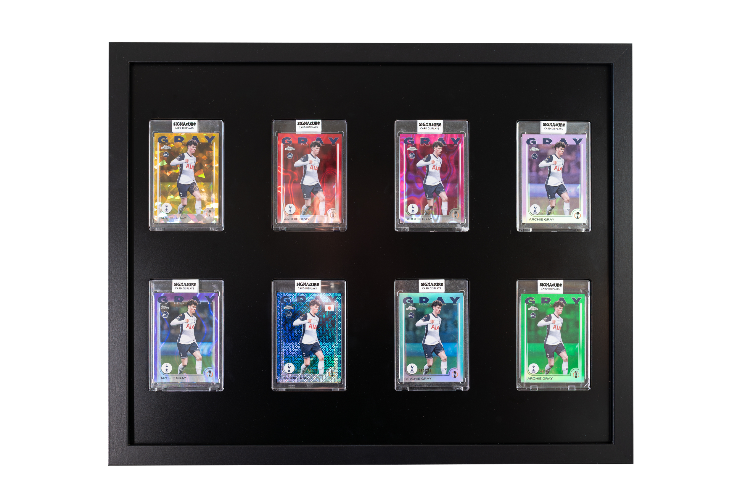 Display case with multiple football trading cards featuring a player in a white and blue Tottenham Hotspur jersey.