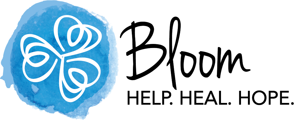 Logo for Bloom organization with a watercolor blue butterfly and the words 'Bloom Help. Heal. Hope.'
