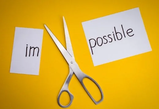 the word impossible cut into two parts im and possible
