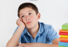 boy with books that is distracted