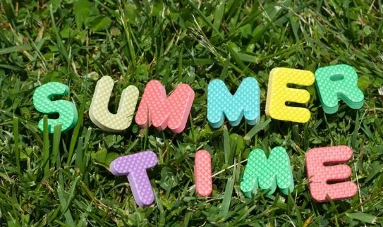 letters in grass that spell out summer time