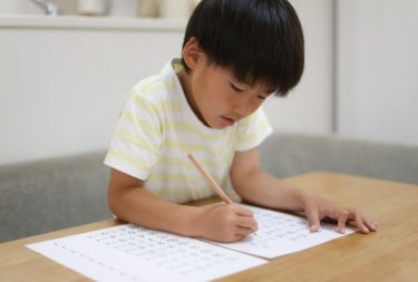 child working on worksheet