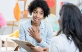teacher talking to parent