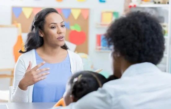 teacher talking to parent and student