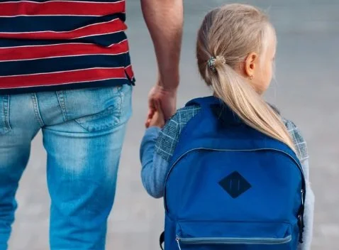 parent walking child into school