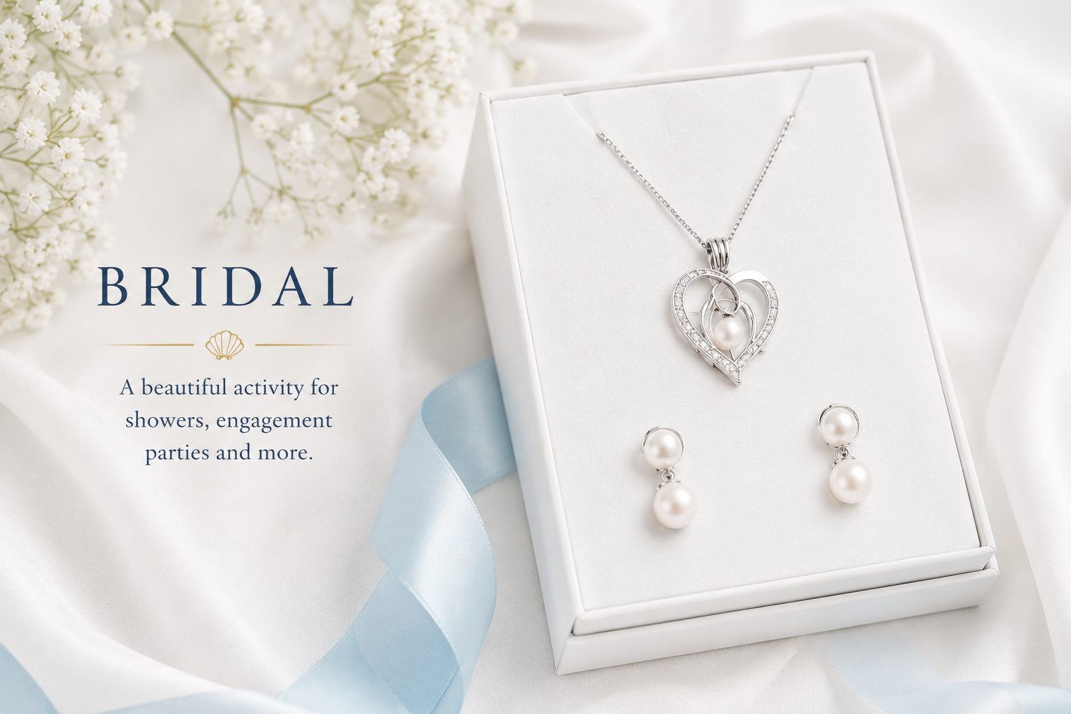 A jewelry set including a pearl necklace with a heart-shaped pendant and matching pearl earrings in a white jewelry box, with white flowers and blue ribbon in the background, promoting bridal accessories for showers and engagement parties.
