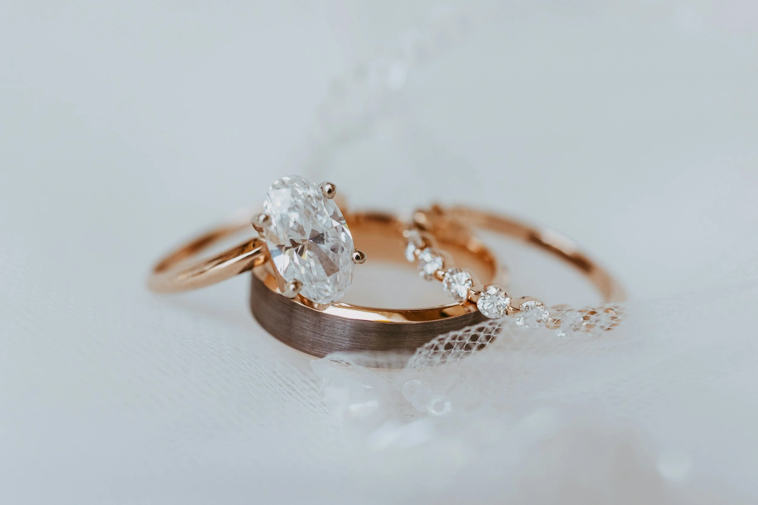Close-up of wedding bands and an engagement ring