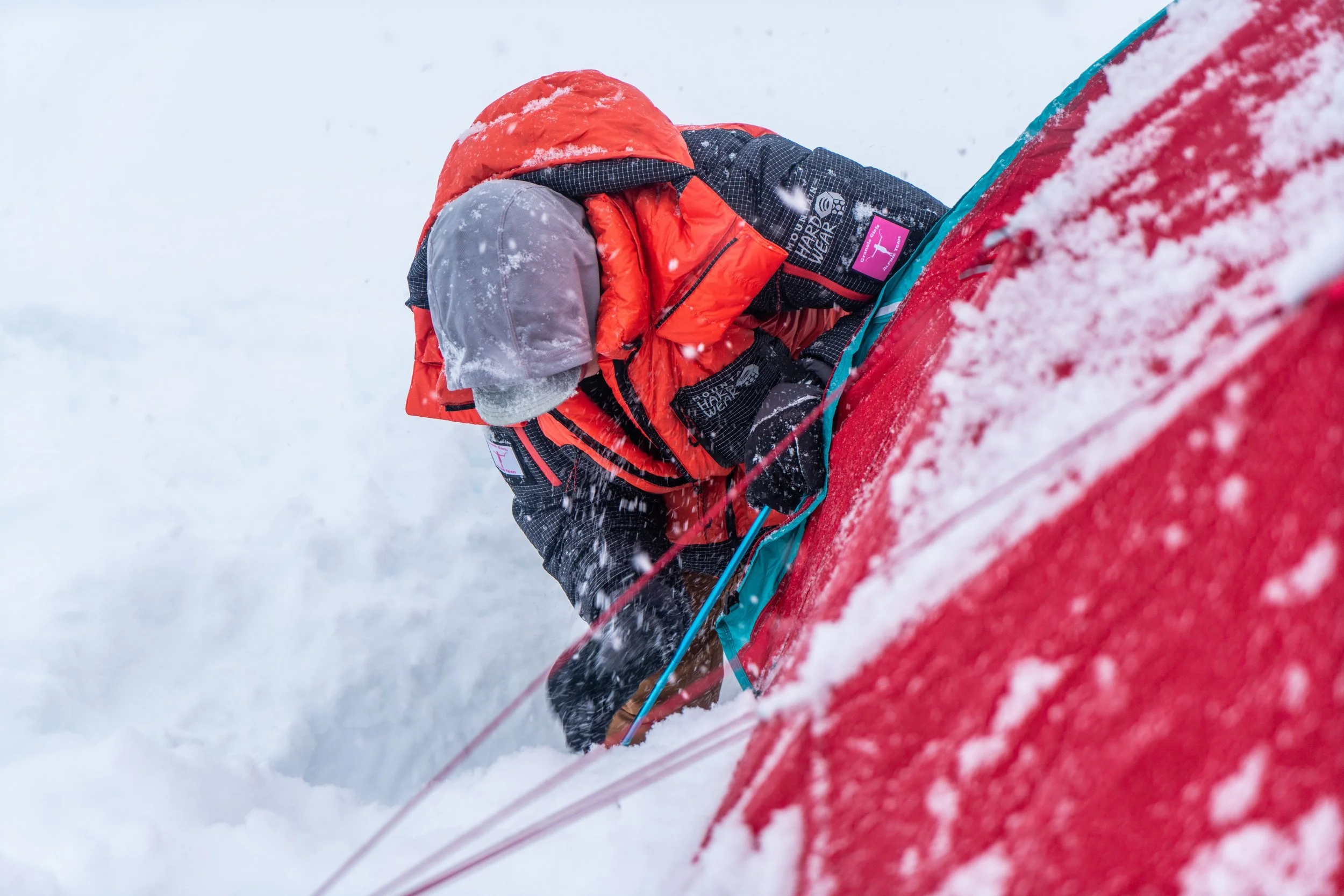Setting up camp in a snowstorm.