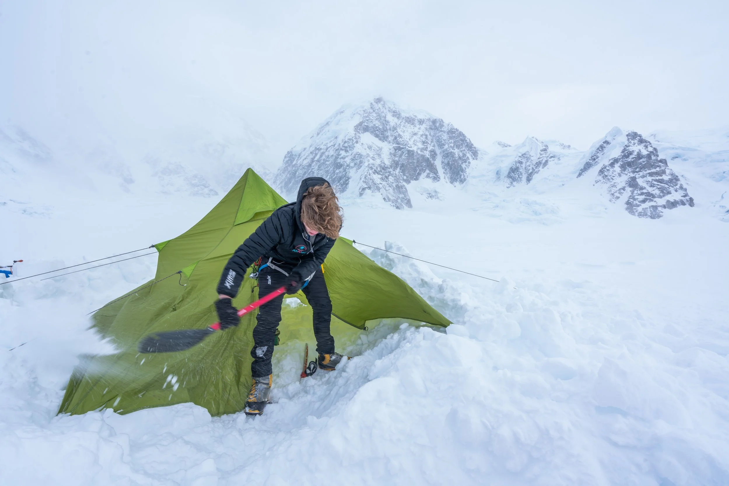 Digging out an entrance to the cook tent at 7800'.