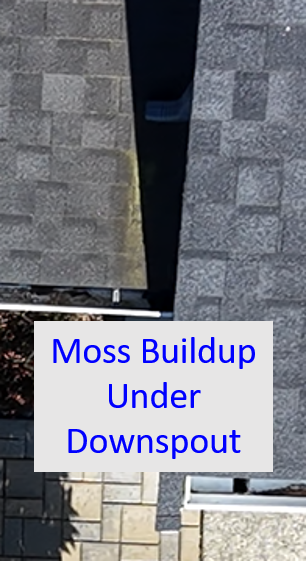 Close-up of a rooftop labelled 'Moss Buildup Under Downspout'.  Drone photography extracted from drone videography.  Original drone video is also provided on the same page.
