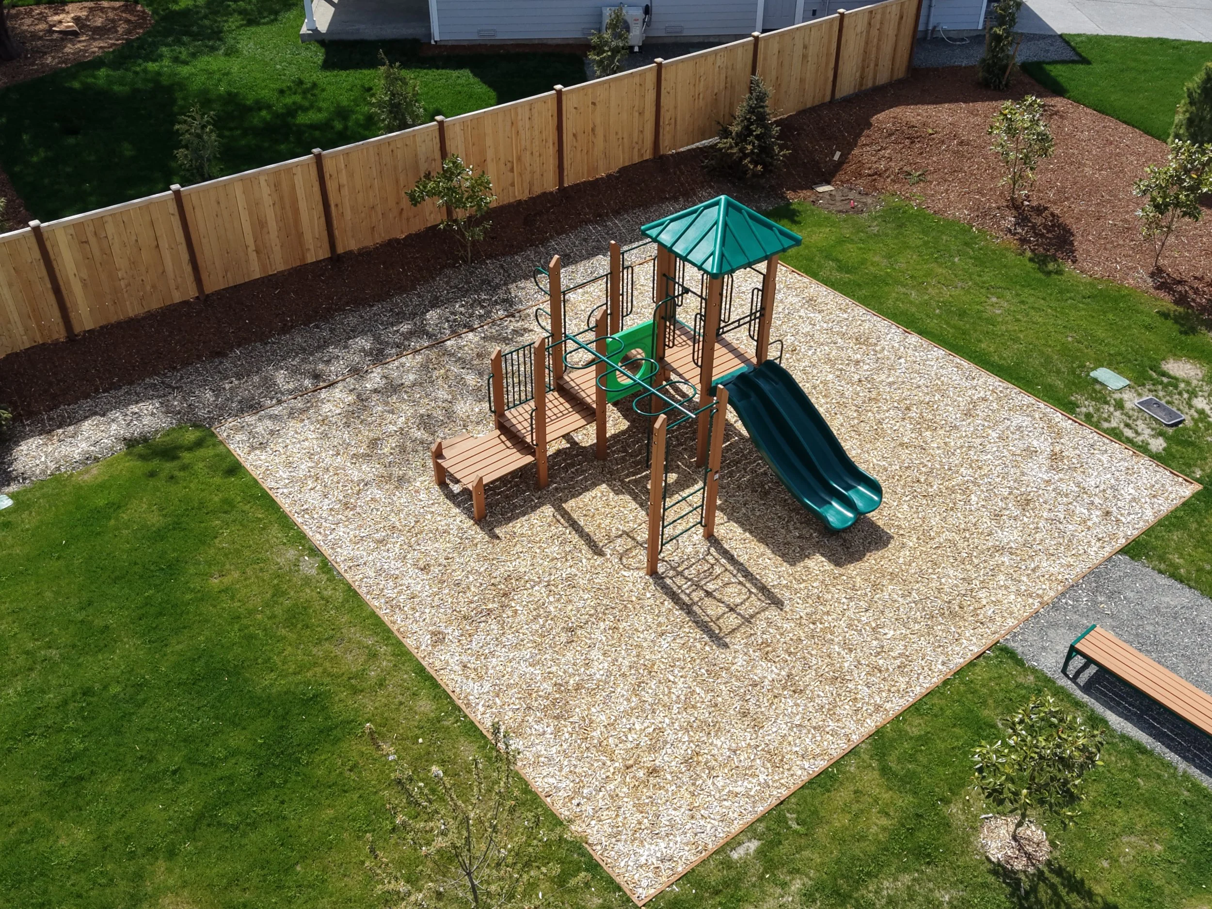 Aerial view of a neighborhood park for drone real estate marketing.  The sale property is key, but highlighting additional features such as HOA parks or swimming pools can better inform buyers and boost interest in your seller's property listing.