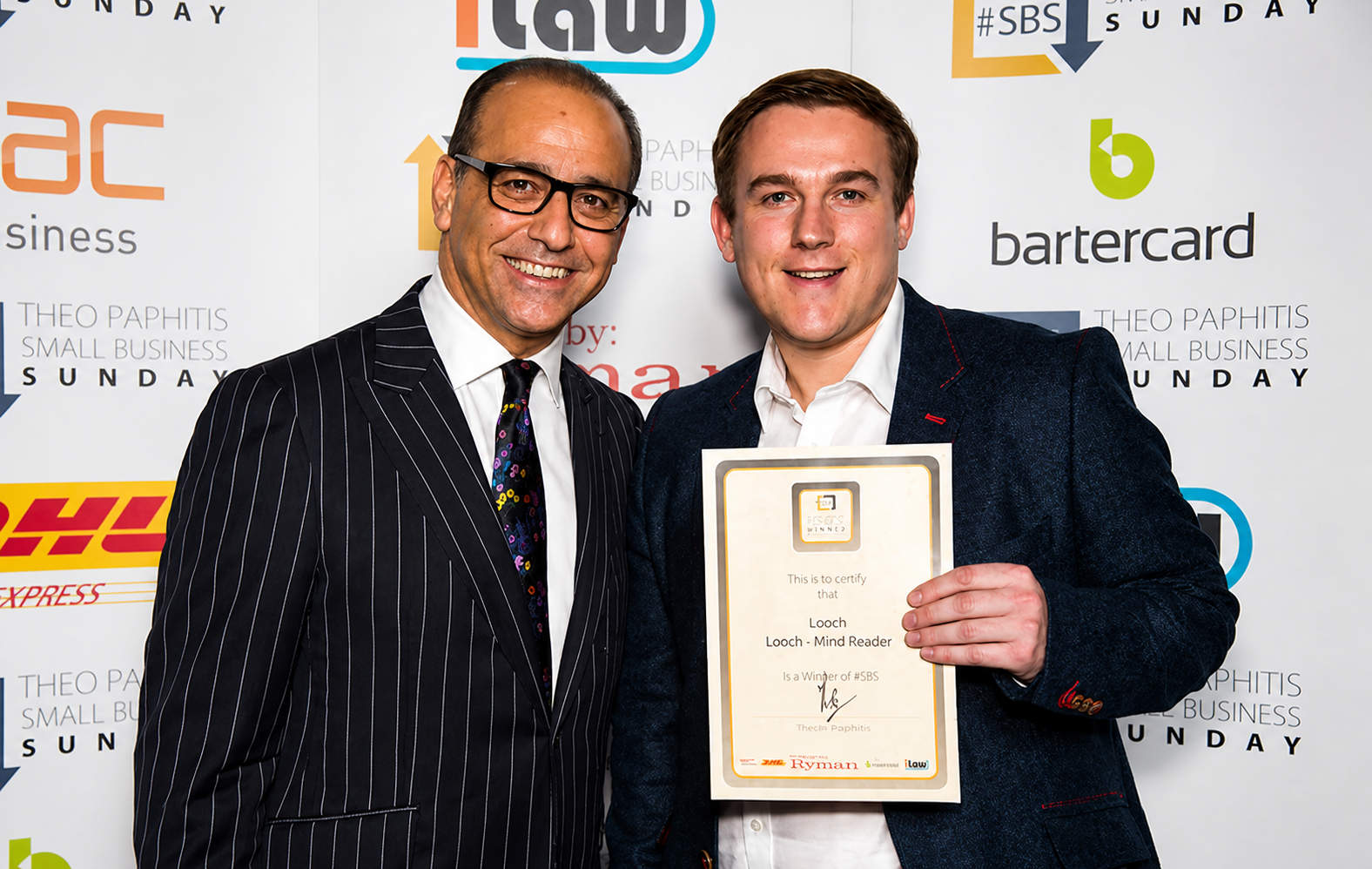 Looch being presented with his winners certificate by Theo