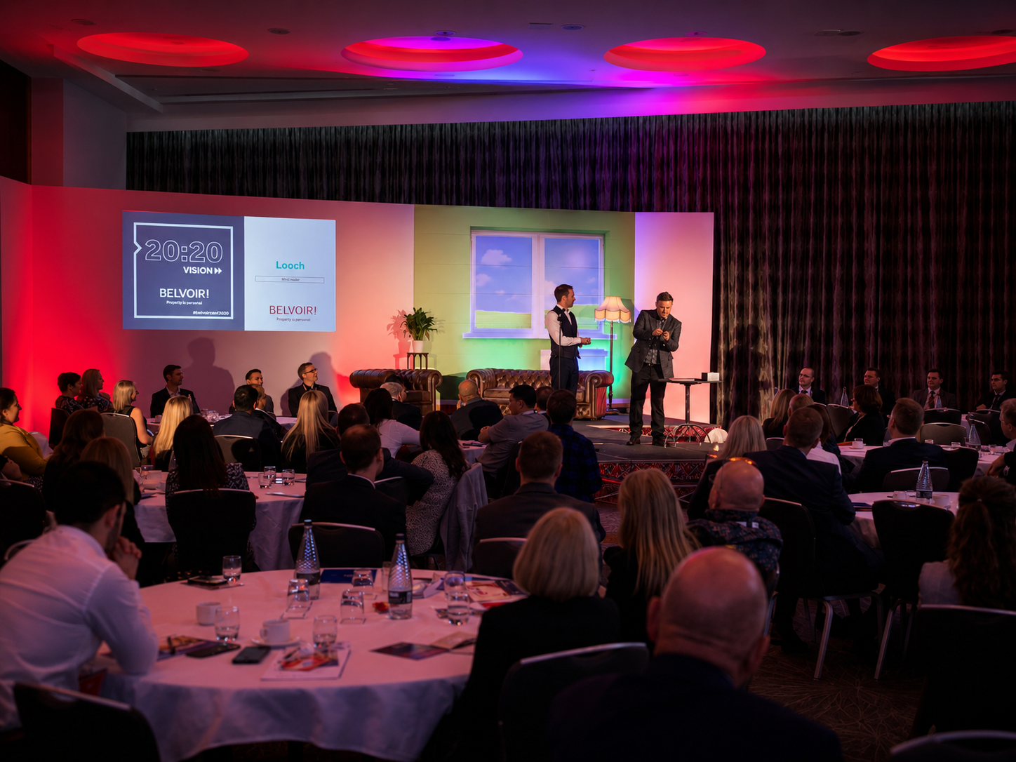 Looch on stage at the conference