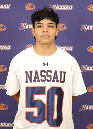 Young male athlete in a Nassau football jersey, standing in front of a Nassau-themed backdrop.
