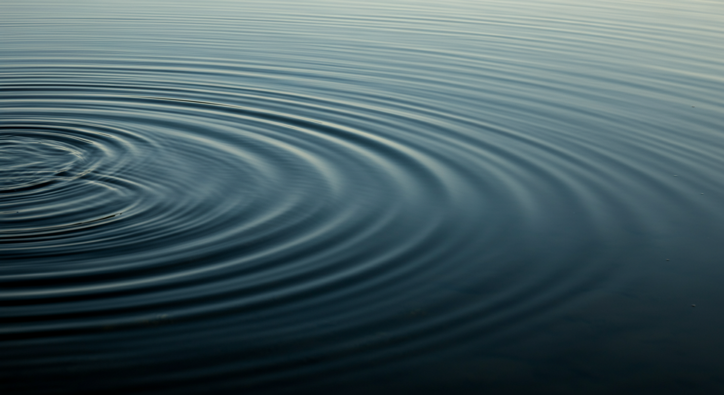 Calm water surface with concentric ripples