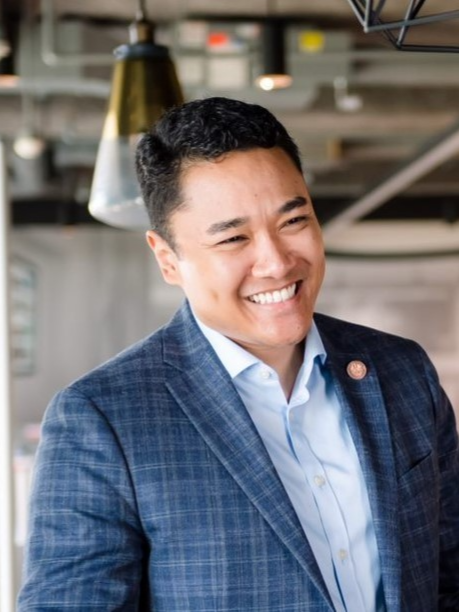 Ivan Perry, founder of ADVON Leadership Advisors, smiling in a business casual setting.