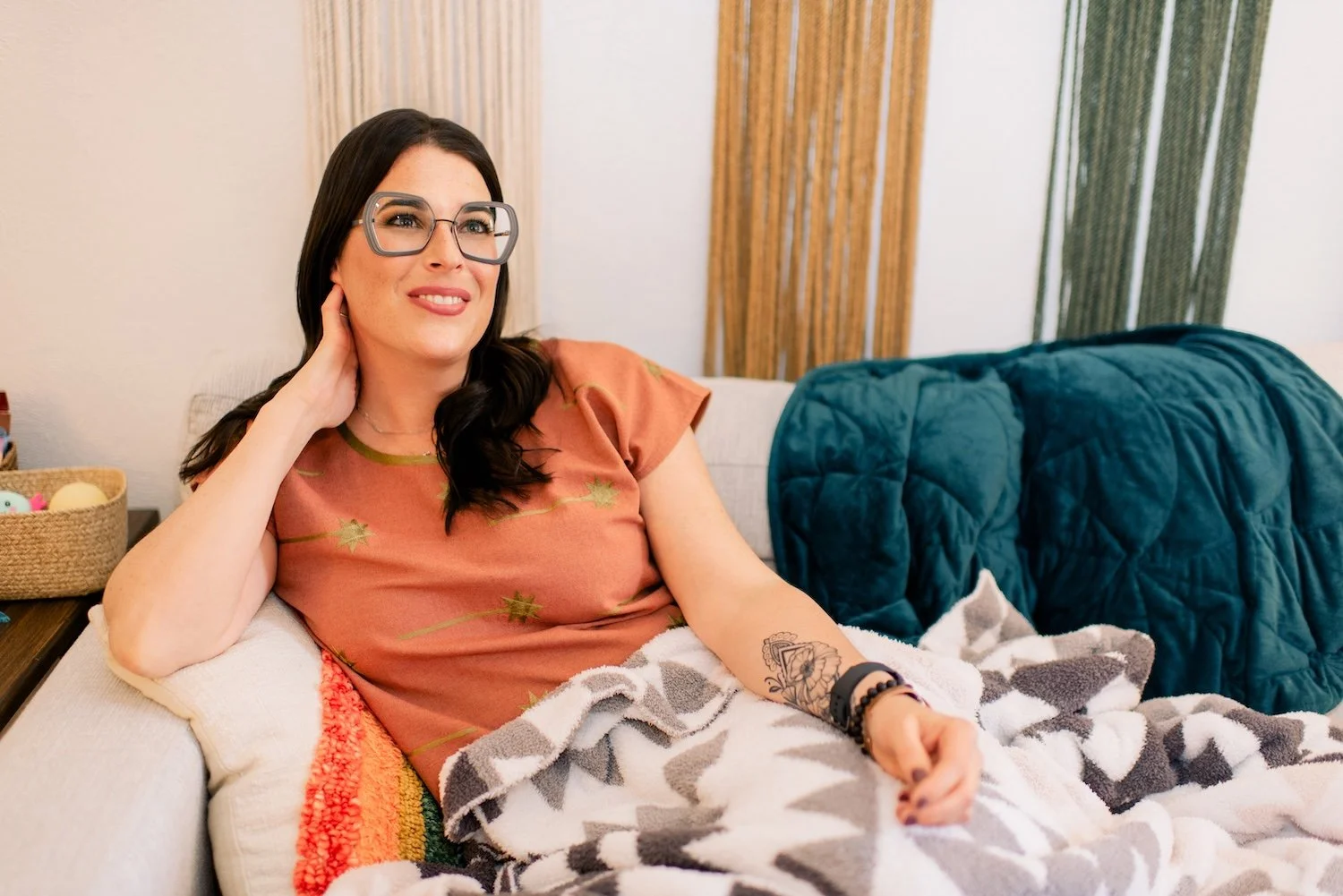 Joann Chevaillier, LPC-Associate, sitting on a couch during an EMDR Therapy session with a client in Fort Worth, Texas.