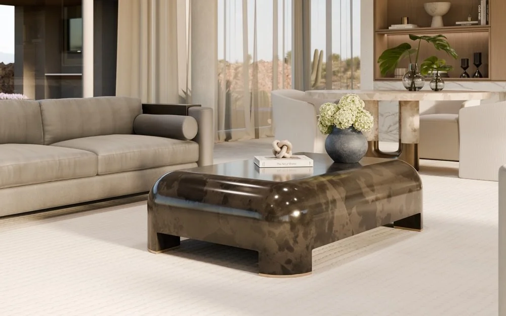 The Clement Coffee Table by @jimecointeriors is a truly stunning piece - pictured here in Charcoal Grey Goatskin with a High Gloss Finish and Bronze Feet. The perfect centerpiece to build a living room around 🤎