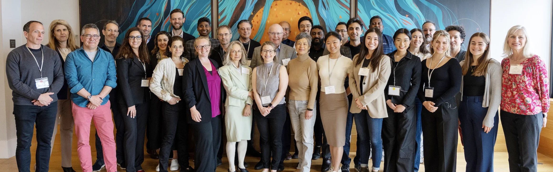 jupytercon team photo of 20+ people standing in a meeting room