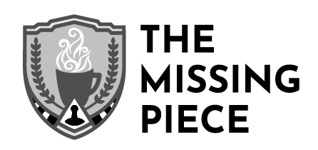 This Missing Piece logo has a shield with a steaming drink in a mug and a board game piece.