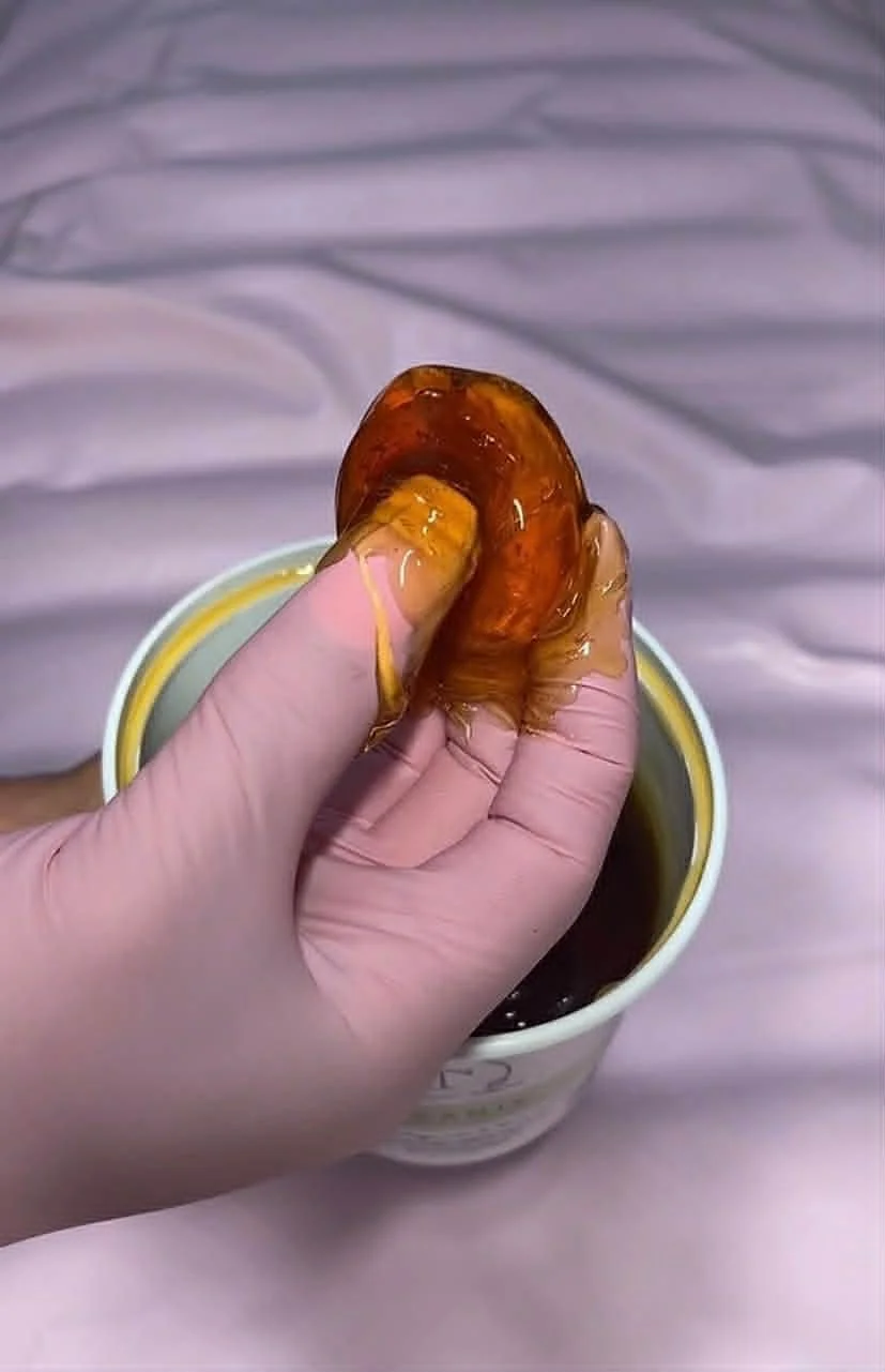 Organic, natural sugaring paste used for body, facial, intimate, eyebrow shaping hair removal services. 