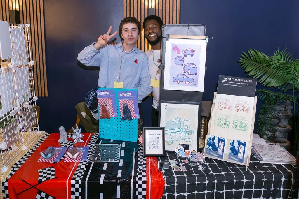   Jawko  and Malachi of  FKA Who Yorker  selling their wares at City Side Café. 