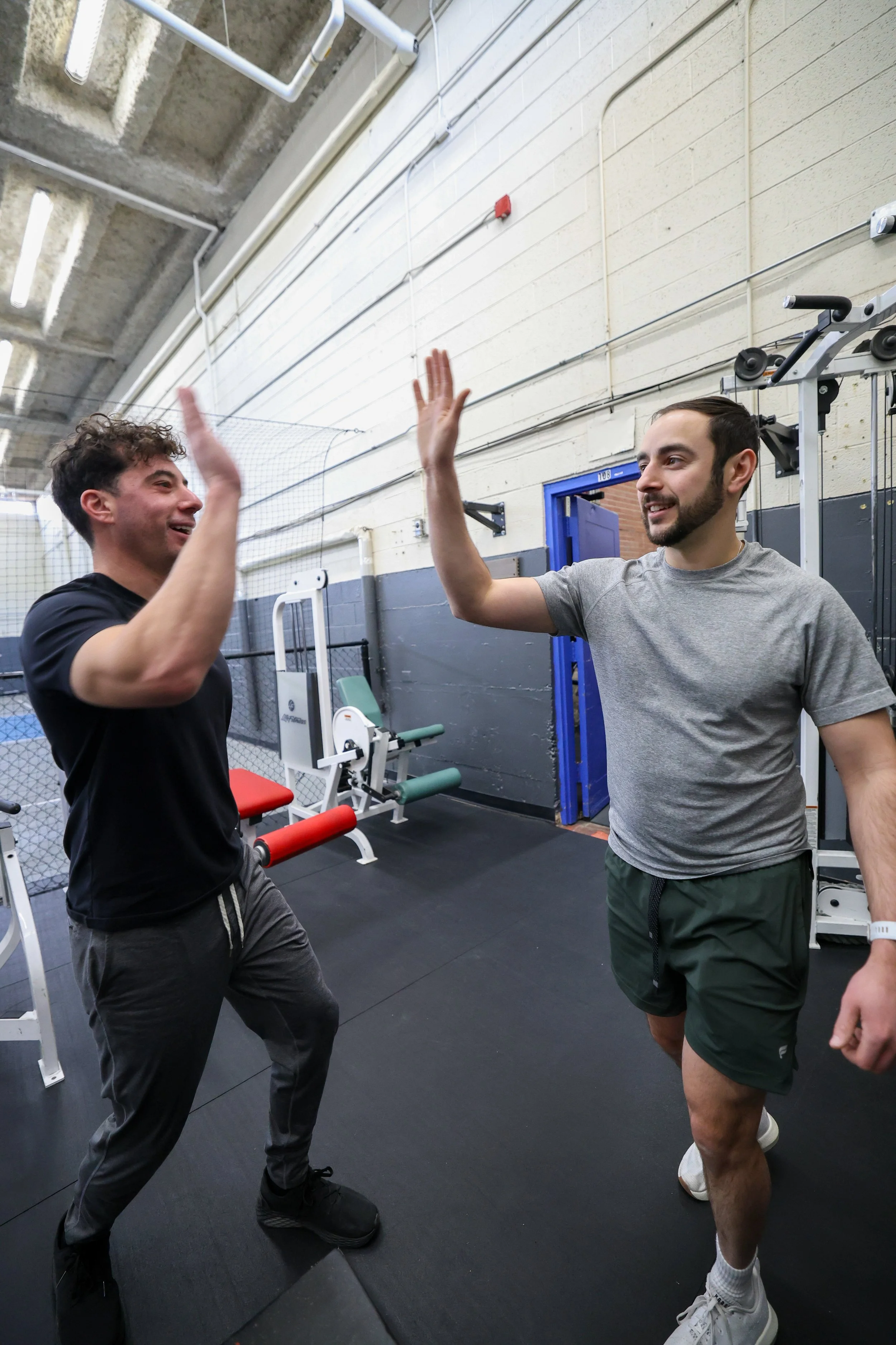 coach giving a high five to a client