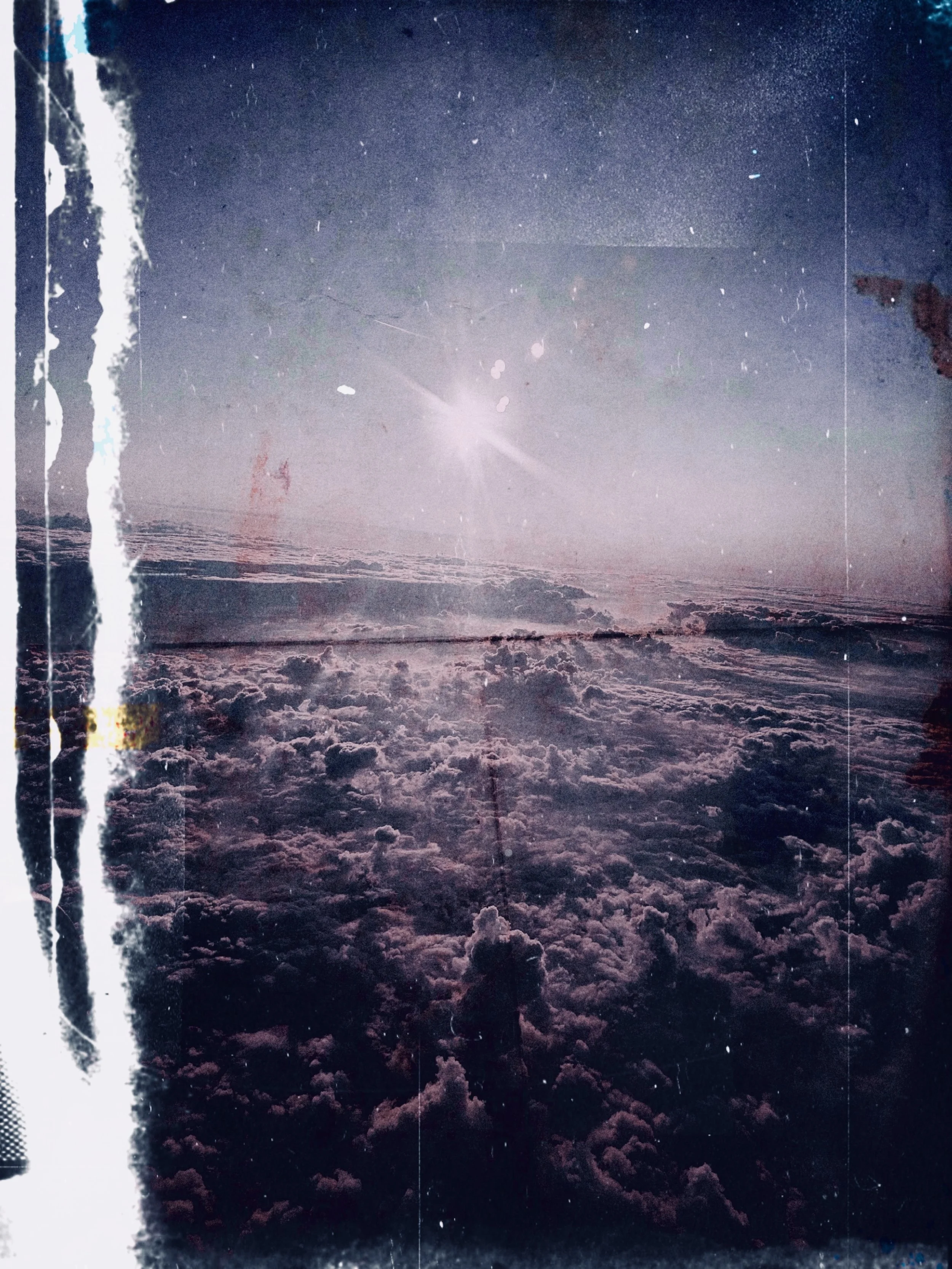 A soft, ethereal abstract background showing clouds in light purple, blending into a brighter center with the sun shining above the clouds, within a black frame and dust effects.